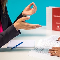 Hands of a solicitor talking to a client